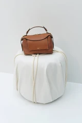 Detail product shot of the Oroton Mica Bowler in Brandy and Premium pebble grain leather for Women .