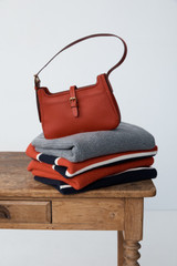 Detail product shot of the Oroton Dylan Mini Baguette Crossbody in DARK RUBY and Premium pebble leather for Women .