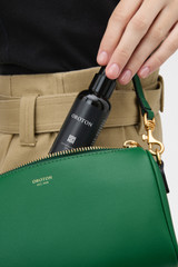 Profile view of model wearing the Oroton Harvey Baguette Crossbody in CROCODILE and Premium smooth leather for Women .