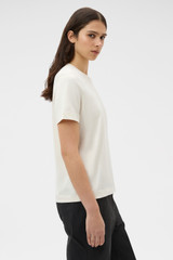 Profile view of model wearing the Oroton Maggie Graphic Tee in Calico and 100% cotton single jersey fabric for Women .