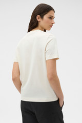 Profile view of model wearing the Oroton Maggie Graphic Tee in Calico and 100% cotton single jersey fabric for Women .