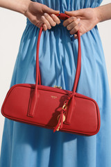 Profile view of model wearing the Oroton Louisa Shoulder Bag in Rouge and Premium smooth leather for Women .