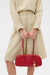 Profile view of model wearing the Oroton Louisa Shoulder Bag in Rouge and Premium smooth leather for Women .