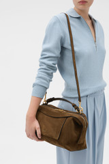 Profile view of model wearing the Oroton Mica Suede Large Bowler in Husk Brown and Premium cow suede leather for Women .