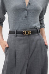 Profile view of model wearing the Oroton Juliette Smooth Reversible Belt in Black/Cinnamon and Premium smooth leather for Women .