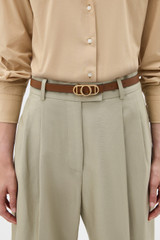 Profile view of model wearing the Oroton Juliette Smooth Reversible Belt in Ecru/Cinnamon and Premium smooth leather for Women .