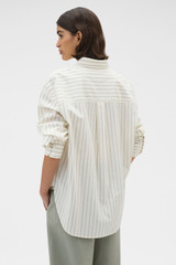 Profile view of model wearing the Oroton Dobby Stripe Shirt in Whipped Cream and 100% cotton fabric for Women .