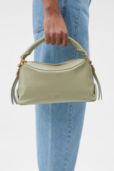 Profile view of model wearing the Oroton Lewis Crackle Day Bag in Pistachio and Premium smooth leather for Women .