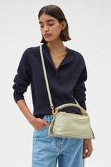 Profile view of model wearing the Oroton Lewis Crackle Day Bag in Pistachio and Premium smooth leather for Women .