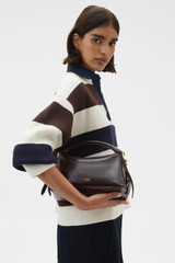Profile view of model wearing the Oroton Lewis Crackle Day Bag in Dark Chocolate and Premium smooth leather for Women .