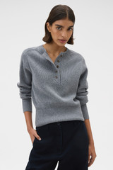 Profile view of model wearing the Oroton Rib Knit Henley in Grey Marle and 100% supersoft merino wool fabric for Women .