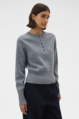 Profile view of model wearing the Oroton Rib Knit Henley in Grey Marle and 100% supersoft merino wool fabric for Women .