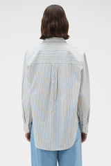 Profile view of model wearing the Oroton Soft Stripe Shirt in Soft Blue and 100% cotton fabric for Women .