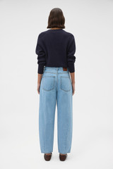 Profile view of model wearing the Oroton Barrel Leg Denim Jean in Light Vintage Wash and 100% cotton fabric for Women .