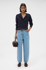 Profile view of model wearing the Oroton Barrel Leg Denim Jean in Light Vintage Wash and 100% cotton fabric for Women .
