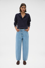 Profile view of model wearing the Oroton Barrel Leg Denim Jean in Light Vintage Wash and 100% cotton fabric for Women .