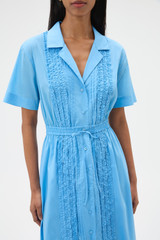 Profile view of model wearing the Oroton Ruffle Detail Shirt Dress in Sea Blue and 100% cotton voile fabric for Women .