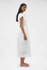 Profile view of model wearing the Oroton Lace Trim Day Dress in White and 100% ramie fabric for Women .