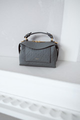 Detail product shot of the Oroton Mica Texture Mini Bowler in Soot and Premium embossed ostrich leather for Women .