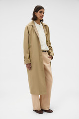 Profile view of model wearing the Oroton Reversible Check Mac in Camel and 100% soft cotton fabric for Women .