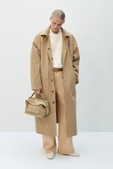 Profile view of model wearing the Oroton Reversible Check Mac in Camel and 100% soft cotton fabric for Women .