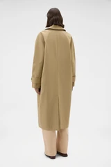 Profile view of model wearing the Oroton Reversible Check Mac in Camel and 100% soft cotton fabric for Women .