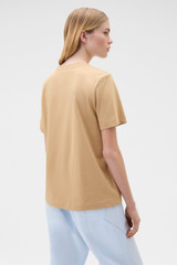 Profile view of model wearing the Oroton Maggie Graphic Tee in Praline and 100% cotton single jersey fabric for Women .