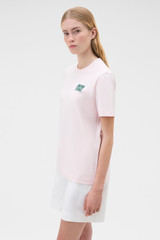 Profile view of model wearing the Oroton Maggie Graphic Tee in Perfect Pink and 100% cotton single jersey fabric for Women .