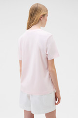 Profile view of model wearing the Oroton Maggie Graphic Tee in Perfect Pink and 100% cotton single jersey fabric for Women .