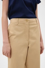Profile view of model wearing the Oroton Arlo Carpenter Chino in Praline and 100% cotton fabric for Women .