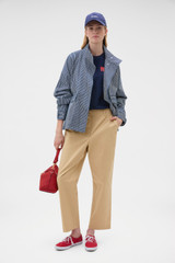 Profile view of model wearing the Oroton Arlo Carpenter Chino in Praline and 100% cotton fabric for Women .
