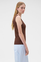 Profile view of model wearing the Oroton Scoop Neck Tank in Chocolate and 92% cotton and 8% spandex blend fabric for Women .