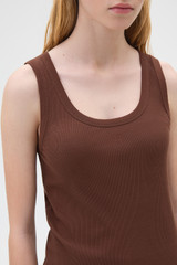 Profile view of model wearing the Oroton Scoop Neck Tank in Chocolate and 92% cotton and 8% spandex blend fabric for Women .