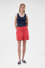Profile view of model wearing the Oroton Scoop Neck Tank in North Sea and 92% cotton and 8% spandex blend fabric for Women .