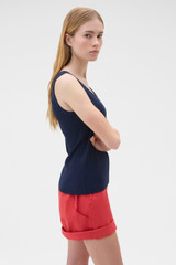 Profile view of model wearing the Oroton Scoop Neck Tank in North Sea and 92% cotton and 8% spandex blend fabric for Women .