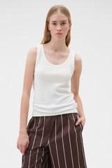 Profile view of model wearing the Oroton Scoop Neck Tank in Antique White and 92% cotton and 8% spandex blend fabric for Women .