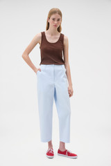 Profile view of model wearing the Oroton Arlo Carpenter Chino in Pale Blue and 100% cotton fabric for Women .