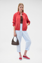 Profile view of model wearing the Oroton Arlo Carpenter Chino in Pale Blue and 100% cotton fabric for Women .