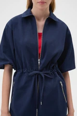 Profile view of model wearing the Oroton Washed Drill Dress in North Sea and 100% cotton fabric for Women .