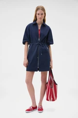 Profile view of model wearing the Oroton Washed Drill Dress in North Sea and 100% cotton fabric for Women .