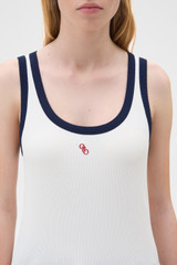 Profile view of model wearing the Oroton Contrast Bind Tank in Antique White and 92% cotton and 8% spandex blend fabric for Women .