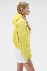 Profile view of model wearing the Oroton Weekend Windbreaker in Daffodil and 100% cotton fabric for Women .