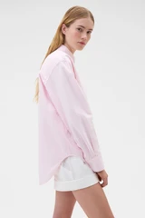 Profile view of model wearing the Oroton Oxford Stripe Shirt in Perfect Pink and 100% cotton fabric for Women .