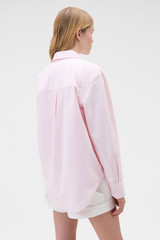 Profile view of model wearing the Oroton Oxford Stripe Shirt in Perfect Pink and 100% cotton fabric for Women .