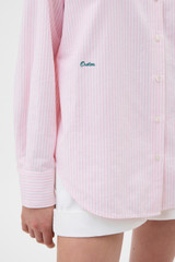 Profile view of model wearing the Oroton Oxford Stripe Shirt in Perfect Pink and 100% cotton fabric for Women .