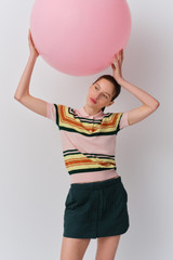 Profile view of model wearing the Oroton Multi Stripe Knit Polo in Multi and 100% cotton fabric for Women .
