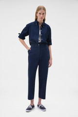 Profile view of model wearing the Oroton Arlo Carpenter Chino in North Sea and 100% cotton fabric for Women .