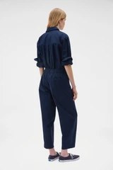 Profile view of model wearing the Oroton Arlo Carpenter Chino in North Sea and 100% cotton fabric for Women .