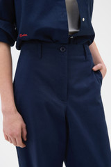 Profile view of model wearing the Oroton Arlo Carpenter Chino in North Sea and 100% cotton fabric for Women .
